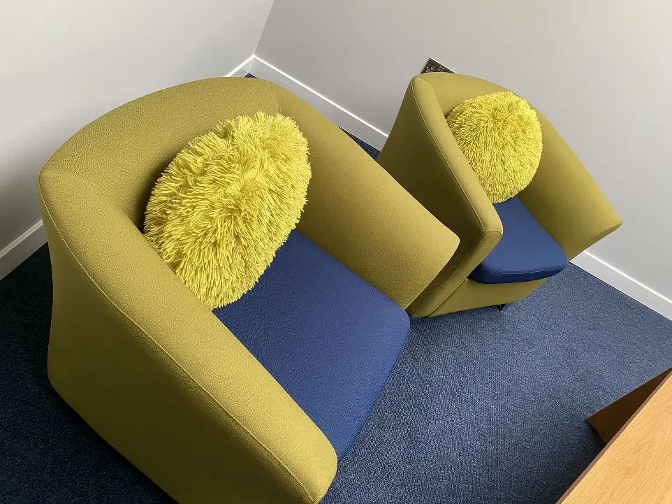 Comfortable chair in the staff room. Navy and green in colour