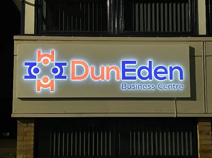 DunEden at night with company logo lit up.